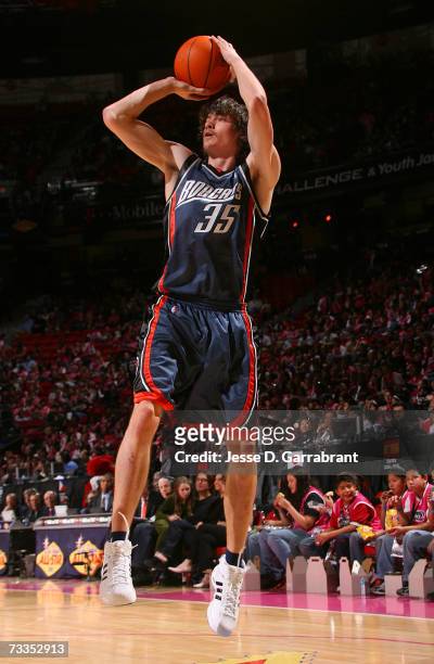 Adam Morrison of the Rookie Team attempts a shot against the Sophomore Team during the T-Mobile Rookie Challenge at NBA All-Star Weekend on February...