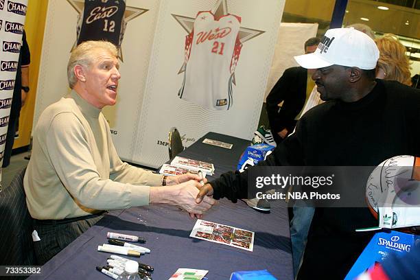Former NBA star Bill Walton signs autographs and greets customers at the Champs Sporting Goods store during NBA All-Star Week festivities at the Las...