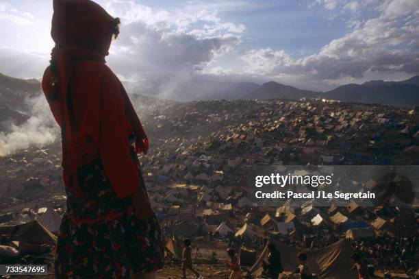 Young girl looks over the masses of tents set up in a Kurdish refugee camp in Iraq following Operation Desert Storm. Hundreds of thousands of Kurds...