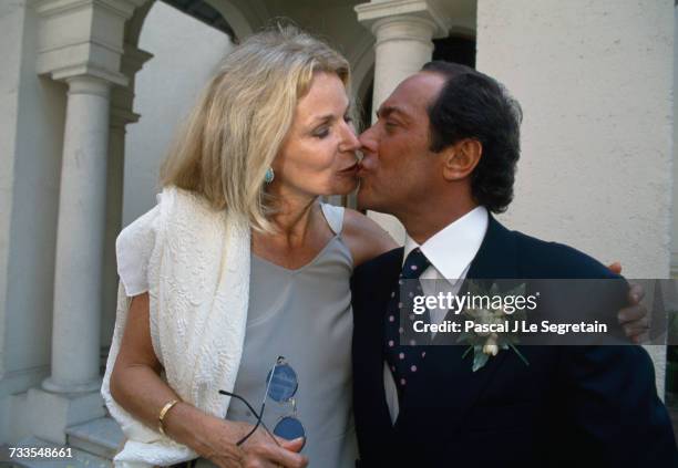 Singer and songwriter Paul Anka kisses his wife Anne at their daughter's wedding. The couple's daughter Alexandra married Yorg Muller in a ceremony...