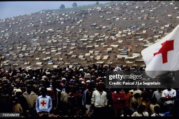Refugees from Nyacyonga camp listening to the speech of the Prime Minister of Rwanda, Agathe Uwilingiyimana.