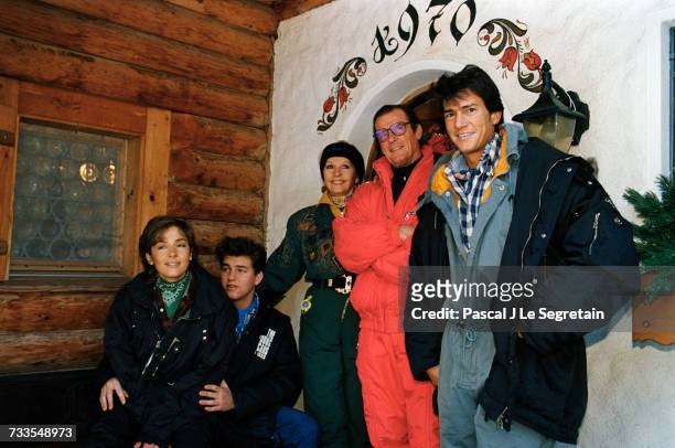English actor Roger Moore is on vacation with his family in Gstaad, Switzerland. Right to left are, son Geoffrey, Roger, Luisa Mattioli, son...