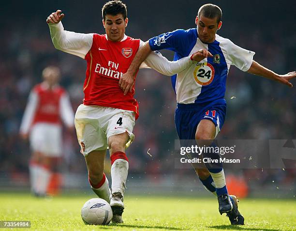 Cesc Fabregas of Arsenal is challenged by David Bentley of Blackburn Rovers during the FA Cup sponsored by E.ON 5th Round match between Arsenal and...