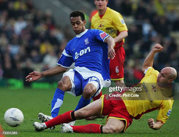 Danny Haynes of Ipswich Town is tackled by Gavin Mahon of Watford during the FA Cup sponsored by E.ON 5th Round match between Watford and Ipswich...