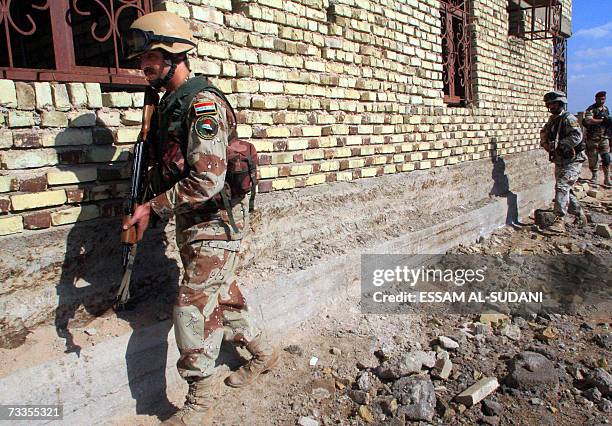 Iraqi army soldiers patrol an area in the southern city of Basra, 17 February 2007. British and Iraqi forces continued today a major security...