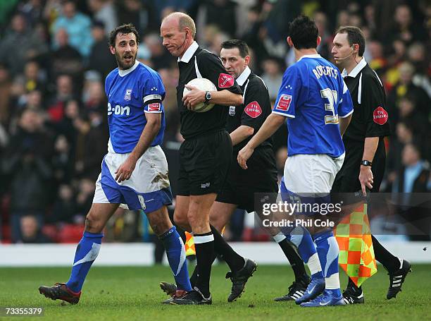 Sylvain Legwinski of Ipswich Town talks to referee Steve Bennett during the FA Cup sponsored by E.ON 5th Round match between Watford and Ipswich Town...