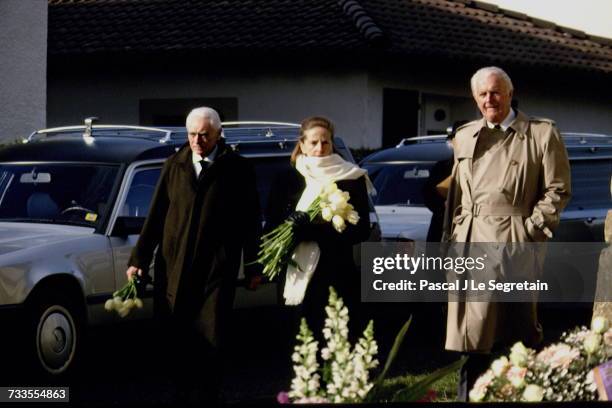 Mel Ferrer, Doris Kleiner and Hubert De Givenchy attend the Funeral Of Audrey Hepburn In Tolochenaz.