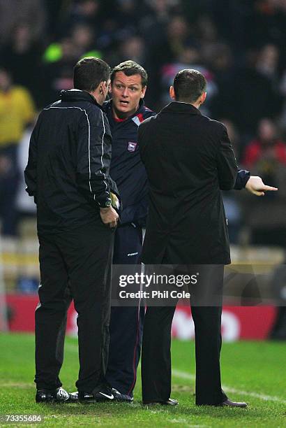 Jim Magilton manager of Ipswich Town confronts fourth official Phil Dowd during the FA Cup sponsored by E.ON 5th Round match between Watford and...