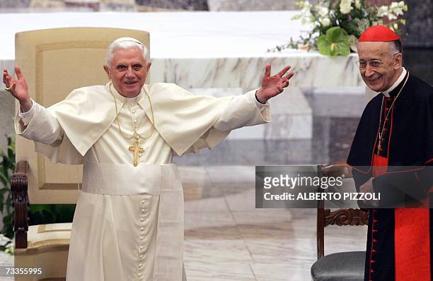 Pope Benedict XVI flanked by Italian cardinal Camillo Ruini salutes during his visit at the Pontificio Seminario Romano Maggiore in Rome, 17 February...