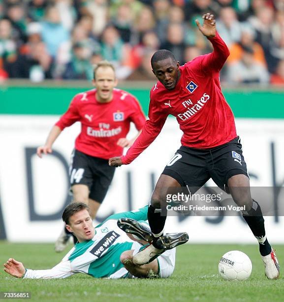 Jurica Vranjes of Werder tussles for the ball with Collin Benjamin of Hamburg during the Bundesliga match between Werder Bremen and Hamburger SV at...