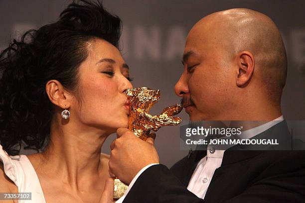 Chinese director Wang Quan'an and his lead actress Nan Yu kiss the Golden Bear for best film for his film Tuya's Mariage, after the closing press...