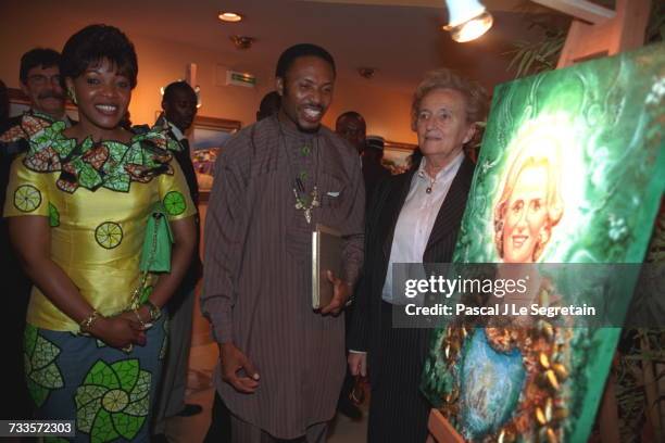 Edith Lucie Bongo and Bernadette Chirac arriving at the Meridien Hotel, where an artist painted a portrait of Mrs. Chirac.