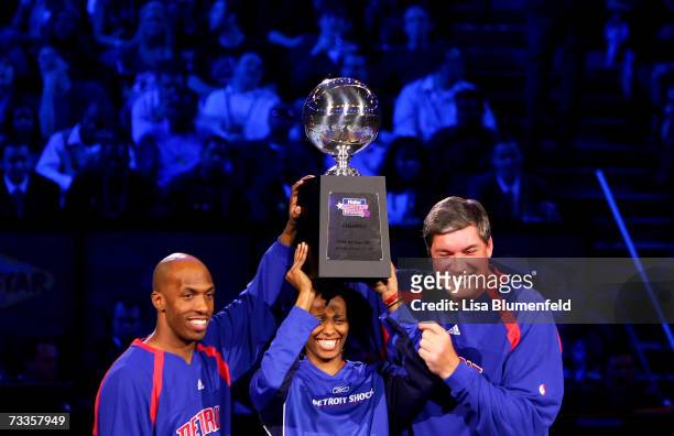 Chauncey Billups, Swin Cash and Bill Laimbeer hold up the trophy after winning the Haier Shooting Stars Competition during NBA All-Star Weekend on...