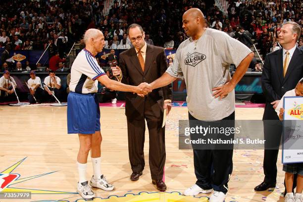 Referee Dick Bavetta and NBA Legend Charles Barkley shake hands after they competed against each other in a Foot Race during All-Star Saturday Night...