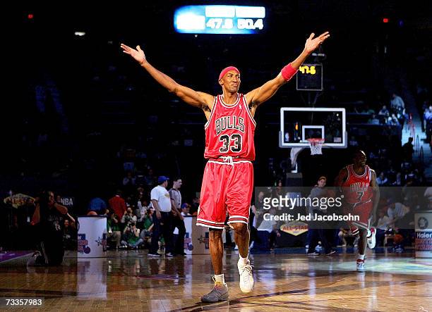 Scottie Pippen of the Chicago team celebrates after sinking a half-court shot in the Haier Shooting Stars Competition during NBA All-Star Weekend on...