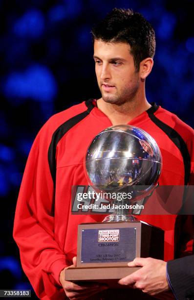 Jason Kapono of the Miami Heat poses with the trophy after winning the Foot Locker Three-Point Shootout during NBA All-Star Weekend on February 17,...