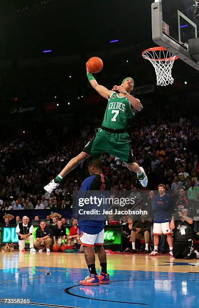 Gerald Green of the Boston Celtics leaps over fellow competitor Nate Robinson of the New York Knicks in the Sprite Slam Dunk Competition during NBA...
