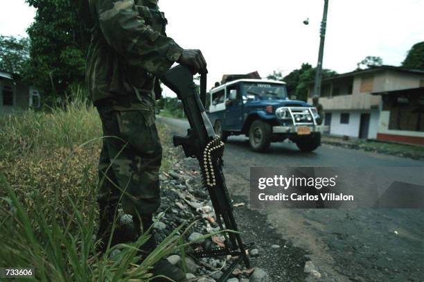 Colombian soldier stands guard October 17, 20000 in the town of La Dorada, Putumayo, Colombia. The army has reestablish the order during day light...