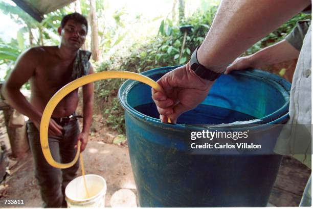 Men make cocaine base October 09, 20000 in Caqueta, Colombia. The product is made by mixing coca leaves with with cement, gasoline, sulfuric acid and...