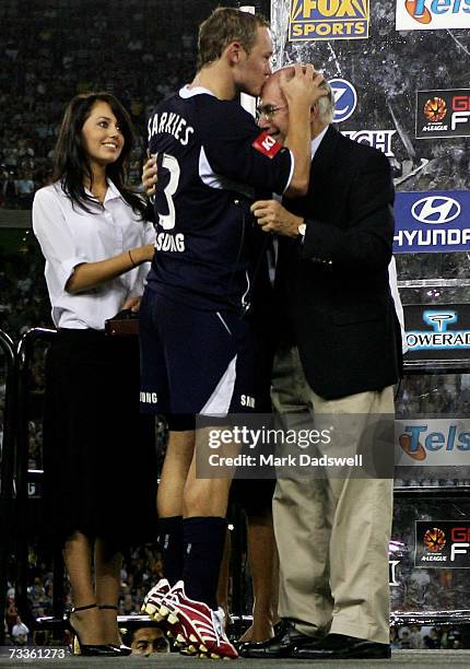 Kristian Sarkies of the Victory kisses Prime Minister John Howard on the head after winning the Hyundai A-League Grand Final between the Melbourne...