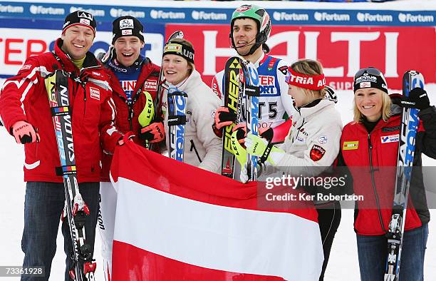 The team from Austria comprising of Fritz Strobl, Benjamin Raich, Marlies Schild, Mario Matt, Michaela Kirchgasser and Renate Goetschl celebrate...