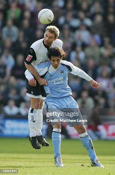 Liam Chilvers of Preston North End beats Bernardo Corradi of Manchester City to the ball during the FA Cup sponsored by E.ON Fifth Round match...