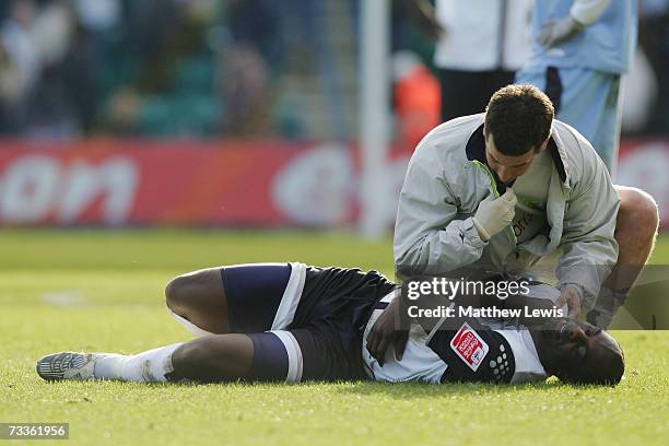 Michael Ricketts of Preston North End receives medical attention during the FA Cup sponsored by E.ON Fifth Round match between Preston North End and...