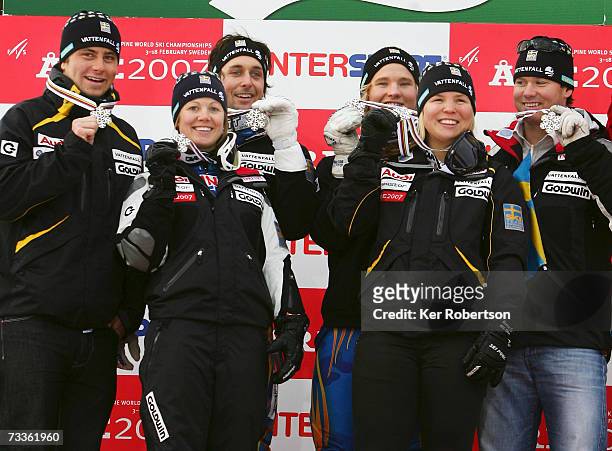 The team from Sweden celebrate with their silver medals after finishing in second place while competing in the Nations Team Event on day sixteen of...