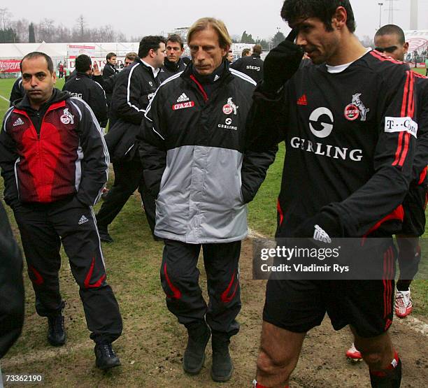Manager Murat Kus, coach Christoph Daum and player Fabio Luciano of Cologne leave the pitch after losing 5:0 the Second Bundesliga match between Rot...