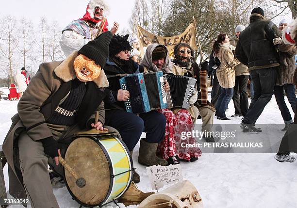 People dance and play music 18 February 2007 as they celebrate 'Uzgavenes' the farewell to winter, which comes on the seventh week before Easter, in...