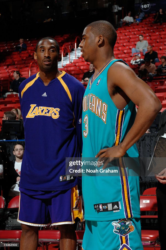 Kobe Bryant of the Los Angeles Lakers talks with Chris Paul of the ...