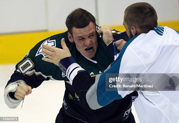 Right wing Krys Barch of the Dallas Stars fights with Kyle McLaren of the San Jose Sharks at the American Airlines Center on February 18, 2007 in...