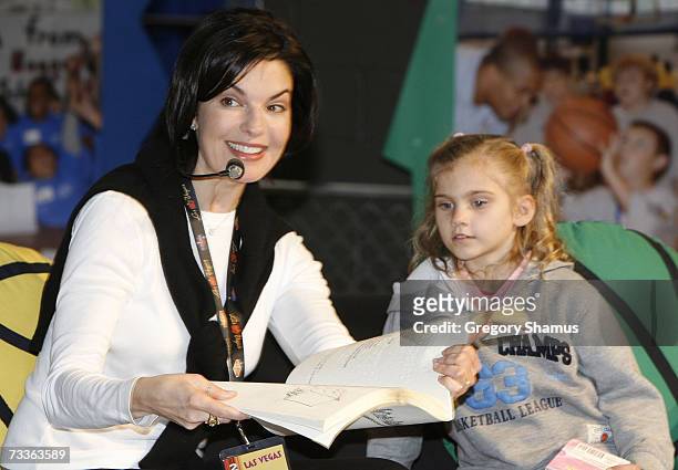 Actress Sela Ward reads to kids at the Read To Achieve/NBA Cares area at the Jam Session during the NBA All Star Weekend on February 17, 2007 in Las...