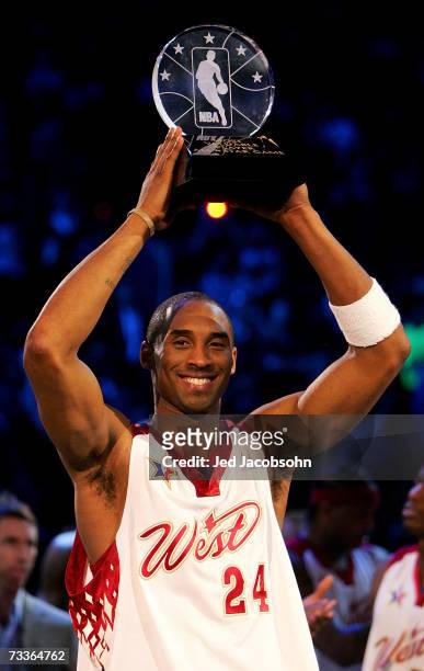 Kobe Bryant of the Western Conference raises the MVP trophy after defeating the Eastern Conference 153 - 132 in the 2007 NBA All-Star Game on...