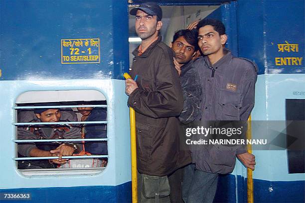 Pakistani train passengers arrive unhurt at the Atari railway station, some 30 km from Amritsar, 19 February 2007 following explosions aboard the...