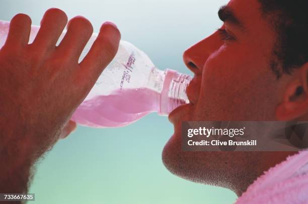 Pete Sampras of the United States takes a drink during the Men's Singles Semi Final match against Sergi Bruguera at the Lipton International Players...