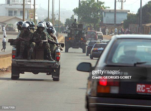 Guinean security forces vehicle rides across Conakry 19 February 2007. Vehicle and pedestrian traffic picked up in Guinea's capital Monday, but...