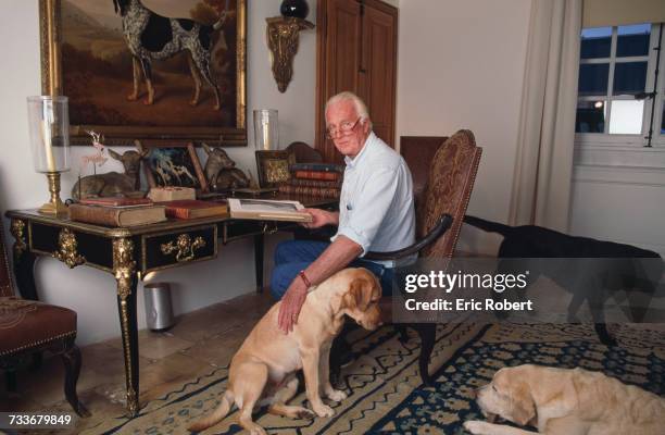 French fashion designer Hubert de Givenchy with his dogs at his home, the Château du Jonchet, in Touraine, France, October 1995.