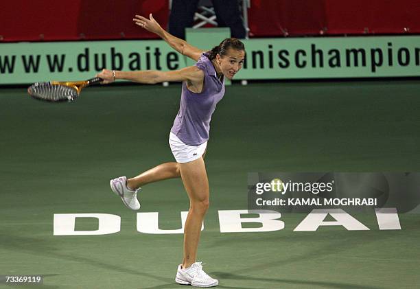 Dubai, UNITED ARAB EMIRATES: Tunisian Selima Sfar returns the ball to her Japanese opponent Ai Sugiyama during their Dubai Duty Free Open tennis...