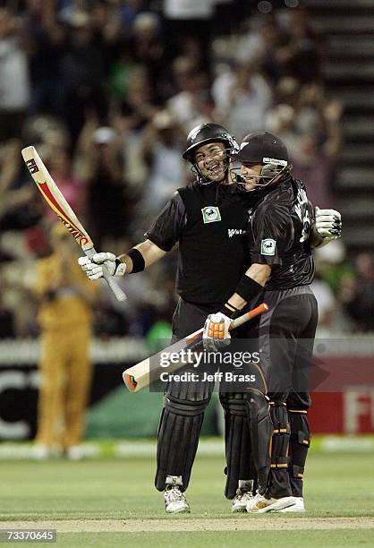 Craig McMillan is congratulated by team-mate Brendon McCullum of New Zealand on scoring 100 runs during the third one-day international match of the...