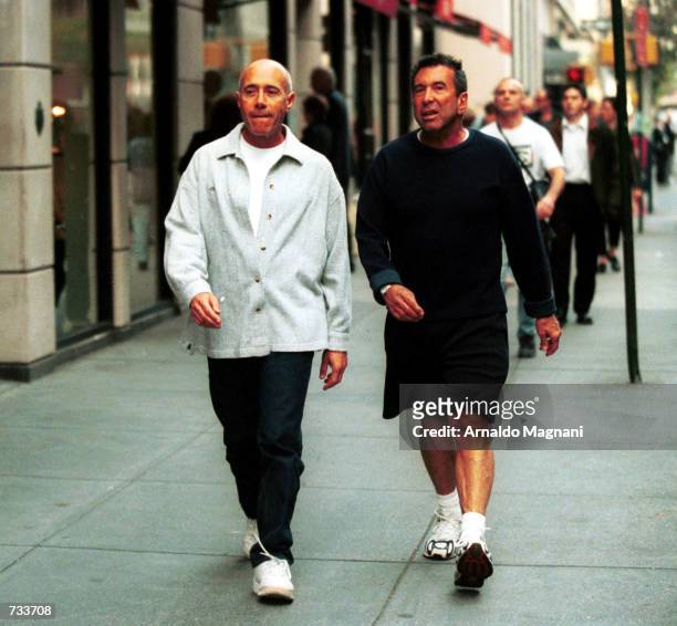 David Geffen, right, walks with talent manager Sandy Gallin on Madison Avenue October 26, 2000 in New York City.