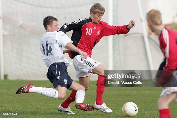 Thomas Harvey of England challenges Toni Kroos of Germany during the Men's U17 international Tournament match between Englad and Germany at the...