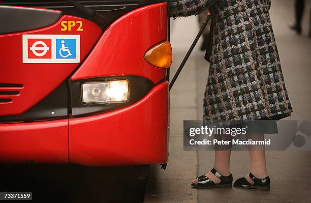 An elderly passenger boards a bus at Victoria station on February 20, 2007 in London. Mayor Ken Livingstone has signed a deal with Venezuela to...