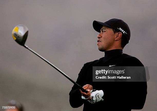 Tiger Woods watches a shot during a practice round prior to the start of the WGC-Accenture Match Play Championship at The Gallery at Dove Mountain on...