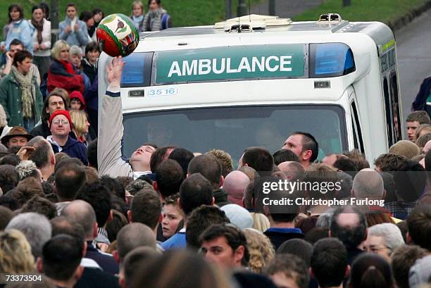 Player clears the ball as an ambulance tries to make it's way to an injured competitor as the Up'ards and Down'ards battle for the ball in the annual...