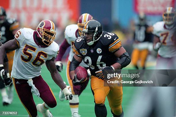 Running back Jerome Bettis of the Pittsburgh Steelers runs the football against Lavar Arrington of the Washington Redskins at Three Rivers Stadium on...