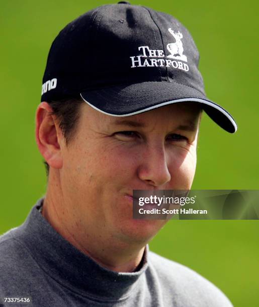 Henry, who will face Tiger Woods in the first round, waits on the practice ground prior to the start of the WGC-Accenture Match Play Championship at...