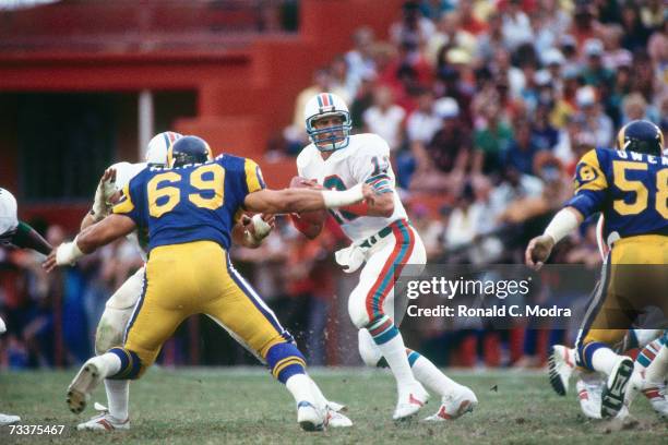 Quarterback Dan Marino of the Miami Dolphins goes back to pass against the Los Angeles Rams on October 30, 1983 in Miami, Florida.