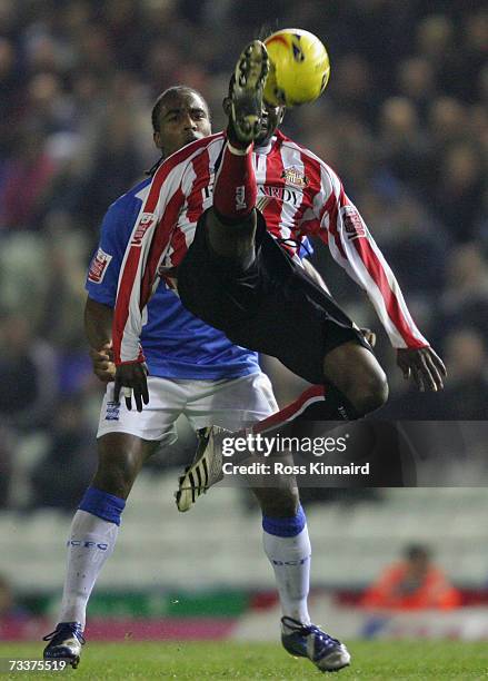 Cameron Jarome of Birmingham is challenged by Dean Whitehead of Sunderland during the Coca-cola Championship match between Birmingham City and...