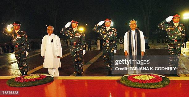 Bangladesh's President Iajudding Ahmed and Chief Advisor of Bangladesh's caretaker government Fakhruddin Ahmed show their respect after laying a...